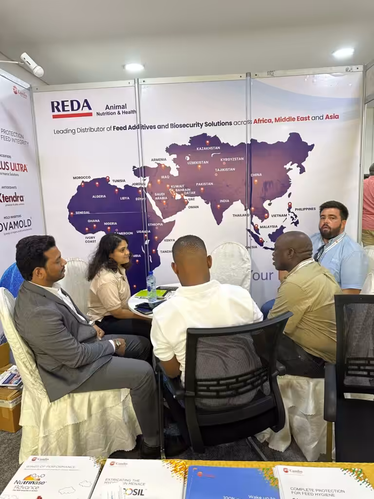 Visitors and the REDA ANH team meeting at the Tanzania Poultry Show 2026 stand